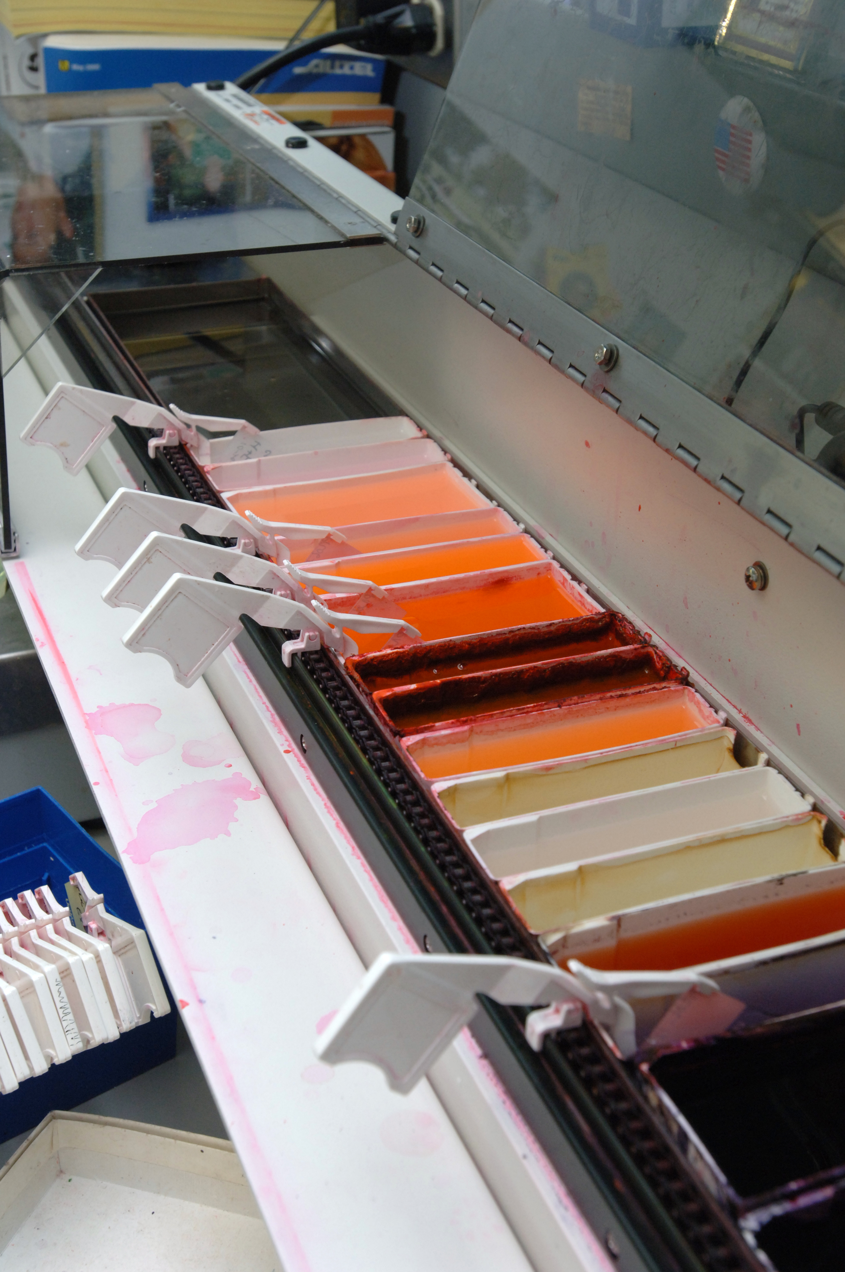Tissue_processing_-_Tissue_sections_on_slides_are_stained_on_an_automated_stainer